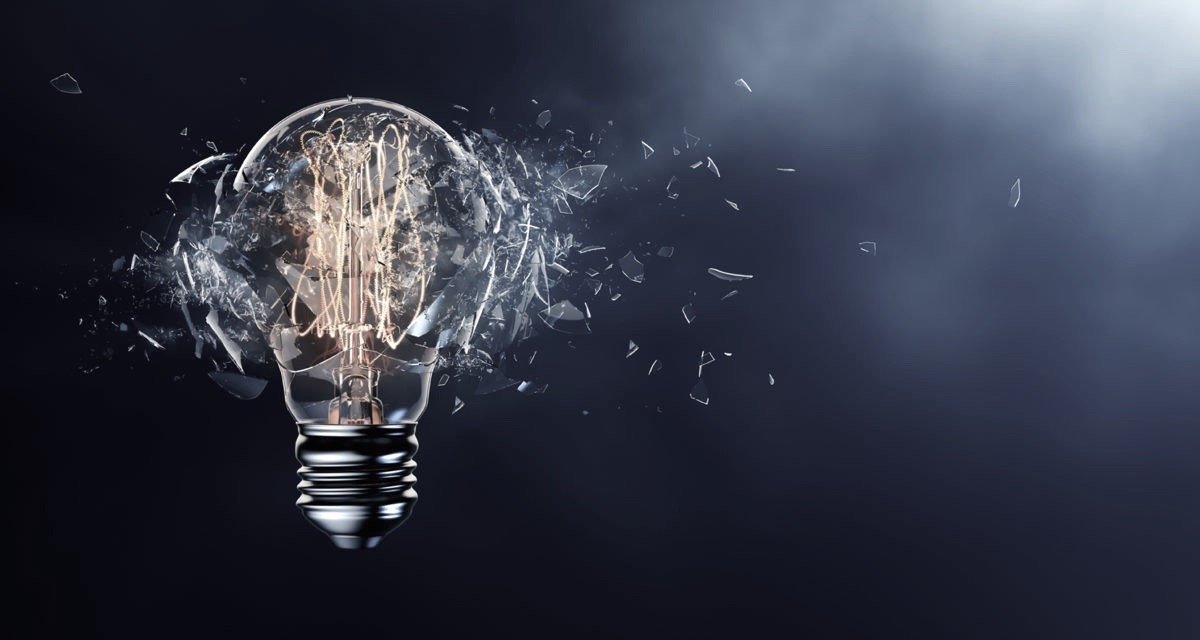Exploding light bulb on a blue background